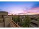 Expansive vista of homes and landscape under a sky ablaze with color at sunset at 12125 Edgehurst Ct, Las Vegas, NV 89138