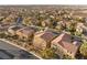 An aerial view of a vibrant neighborhood featuring well-maintained homes, lush landscaping, and community pools at 1265 Vietti St, Henderson, NV 89012