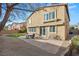 Secluded backyard with patio, artificial turf, mature trees, and outdoor seating area at 1265 Vietti St, Henderson, NV 89012