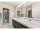 Spacious bathroom with double sinks, large mirror, and access to a shower/tub at 1265 Vietti St, Henderson, NV 89012