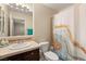 Bright bathroom featuring a vanity with a cream sink and decorative shower curtain at 1265 Vietti St, Henderson, NV 89012