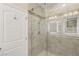 Modern tiled shower with glass doors and contemporary fixtures, offering a sleek design at 1265 Vietti St, Henderson, NV 89012