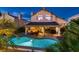 Inviting backyard with pool, hot tub, and covered patio, ideal for relaxation and entertaining at 13 Cozy Glen Cir, Henderson, NV 89074