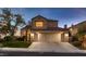 Charming two-story home featuring a three-car garage and well-maintained landscaping at 13 Cozy Glen Cir, Henderson, NV 89074