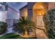 Inviting front entrance with a tiled walkway, lush greenery, and a cozy, covered entryway at 13 Cozy Glen Cir, Henderson, NV 89074