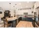 Modern kitchen with granite countertops, stainless steel appliances, and custom cabinetry at 13 Cozy Glen Cir, Henderson, NV 89074