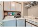 Functional laundry room with washer, dryer, and storage cabinets at 13 Cozy Glen Cir, Henderson, NV 89074