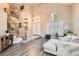Open-concept living room with a staircase and plenty of natural light, creating an inviting atmosphere at 13 Cozy Glen Cir, Henderson, NV 89074
