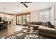 Cozy living room with an open layout, seamlessly blending with the kitchen area at 13 Cozy Glen Cir, Henderson, NV 89074