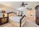 Main bedroom with a ceiling fan, closet and a dark wood wardrobe cabinet at 13 Cozy Glen Cir, Henderson, NV 89074