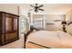 Comfortable main bedroom featuring a fireplace, a large wardrobe and carpeted floors at 13 Cozy Glen Cir, Henderson, NV 89074