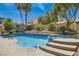 Beautiful pool with hot tub and mature landscaping provides a serene outdoor experience at 13 Cozy Glen Cir, Henderson, NV 89074
