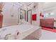 Bright bathroom featuring a soaking tub, glass shower, and stylish fixtures at 17 Chatmoss Rd, Henderson, NV 89052
