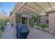 Charming courtyard area with a pergola, pavers, lush plants and space for outdoor living at 17 Chatmoss Rd, Henderson, NV 89052