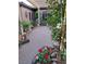 Exterior view showcases stone pathway, lush vegetation and potted flower beds in a peaceful space at 17 Chatmoss Rd, Henderson, NV 89052