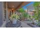 Covered patio features stylish outdoor seating, plants, pergola offering a perfect spot to relax at 17 Chatmoss Rd, Henderson, NV 89052