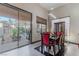 Open dining area with modern lighting, large windows, and easy access to the outdoor patio at 17 Chatmoss Rd, Henderson, NV 89052