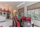 Dining area featuring modern lighting, large windows, and views of the backyard patio area at 17 Chatmoss Rd, Henderson, NV 89052