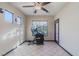 Bright exercise room featuring tile flooring, ample natural light, and workout equipment at 17 Chatmoss Rd, Henderson, NV 89052
