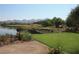 Golf course view with lush greenery, water features, and mountain views at 17 Chatmoss Rd, Henderson, NV 89052