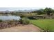 A panoramic view of the golf course showcases a serene lake and mountain views at 17 Chatmoss Rd, Henderson, NV 89052