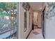 Bright hallway with a view of an atrium, unique lighting, and decorative accents at 17 Chatmoss Rd, Henderson, NV 89052