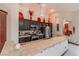 Well-equipped kitchen with stainless steel appliances, a breakfast bar, and dark wood cabinets at 17 Chatmoss Rd, Henderson, NV 89052