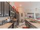 Modern kitchen with stainless appliances, ample counter space, and dark wood cabinetry at 17 Chatmoss Rd, Henderson, NV 89052