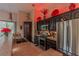 Modern kitchen with stainless steel appliances, dark cabinets, and a tile countertop under recessed lighting at 17 Chatmoss Rd, Henderson, NV 89052