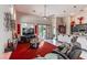 A spacious living area with a TV, comfortable seating, and an open layout connecting to the kitchen at 17 Chatmoss Rd, Henderson, NV 89052
