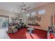 Bright, open living area features a ceiling fan and large windows, creating a comfortable atmosphere at 17 Chatmoss Rd, Henderson, NV 89052