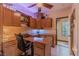Inviting office space with custom cabinets, a built-in desk, and natural light streaming through a nearby window at 17 Chatmoss Rd, Henderson, NV 89052