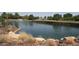 Scenic pond with fountains and manicured grass and rocks lining the water's edge at 17 Chatmoss Rd, Henderson, NV 89052