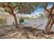Serene backyard featuring a relaxing hammock nestled between trees, creating a peaceful retreat at 1707 Navarre Ln, Henderson, NV 89014