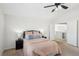 Bedroom with neutral decor, a ceiling fan, and an open doorway to the rest of the house at 1707 Navarre Ln, Henderson, NV 89014