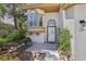 Inviting home entrance with a decorative front door, desert landscaping, and an address plaque at 1707 Navarre Ln, Henderson, NV 89014