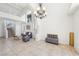 Spacious living room with tile floors, high ceilings, staircase, and comfortable seating at 1707 Navarre Ln, Henderson, NV 89014