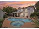 Inviting backyard pool and spa with a covered patio, perfect for outdoor relaxation and entertainment at 1707 Navarre Ln, Henderson, NV 89014