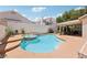 Enjoy the backyard oasis with a sparkling pool, spa, and covered patio for ultimate relaxation and fun at 1707 Navarre Ln, Henderson, NV 89014