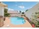 Private backyard featuring a sparkling pool, relaxing spa, and well-kept landscaping for year-round enjoyment at 1707 Navarre Ln, Henderson, NV 89014