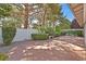 Backyard featuring a concrete patio, brick fence and mature trees at 1901 Calle De Espana, Las Vegas, NV 89102