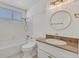 Bright bathroom features a shower-tub combo, white cabinets, and granite countertops at 1901 Calle De Espana, Las Vegas, NV 89102