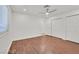 Well-lit bedroom with ceiling fan, hardwood floors, and closet space at 1901 Calle De Espana, Las Vegas, NV 89102