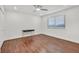 Bright bedroom with hardwood floors, ceiling fan, and a large window at 1901 Calle De Espana, Las Vegas, NV 89102