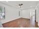 Spacious bedroom featuring wood floors, ceiling fan, and large windows at 1901 Calle De Espana, Las Vegas, NV 89102