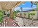 Inviting courtyard with a stone pathway, lush greenery, and a decorative water feature, creating a tranquil outdoor space at 1901 Calle De Espana, Las Vegas, NV 89102