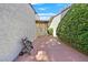 Side yard featuring patio with lush landscaping and tile roof at 1901 Calle De Espana, Las Vegas, NV 89102
