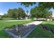 Fun horseshoe pit surrounded by lush greenery and mature trees, perfect for friendly games and outdoor enjoyment at 1901 Calle De Espana, Las Vegas, NV 89102