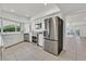 Bright kitchen featuring stainless steel appliances, white cabinets, and tile flooring at 1901 Calle De Espana, Las Vegas, NV 89102