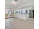 Open kitchen and living area with sliding glass doors and tile flooring at 1901 Calle De Espana, Las Vegas, NV 89102